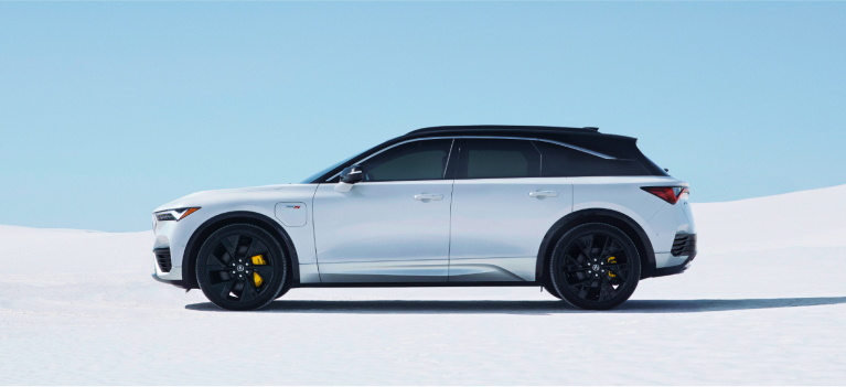 Side View of White Acura ZDX parked on bright white salt flats