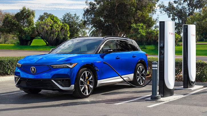 2025 Acura ZDX Type S charging in a Tesla Super Charger